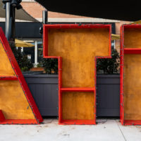 Athens, United States: December 12, 2020: ATH Box Letters Painted Red are a fun display of public art